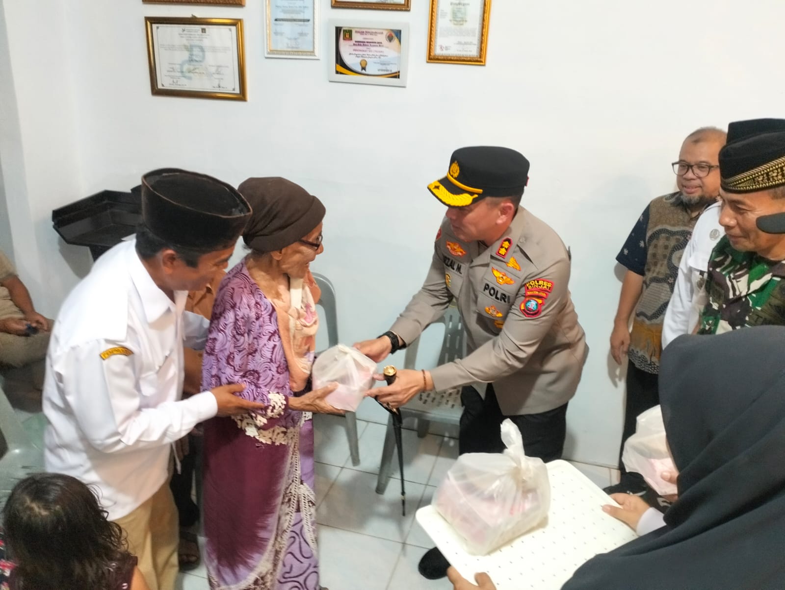 KAPOLRES BINJAI BERBAGI KEBAIKAN DIBULAN SUCI RAMADHAN 1447 H BERSAMA WARGA KECAMATAN BINJAI